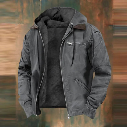Grey version of the hooded zip jacket, unzipped to show the dark fleece lining, against a blurred rustic backdrop. 4