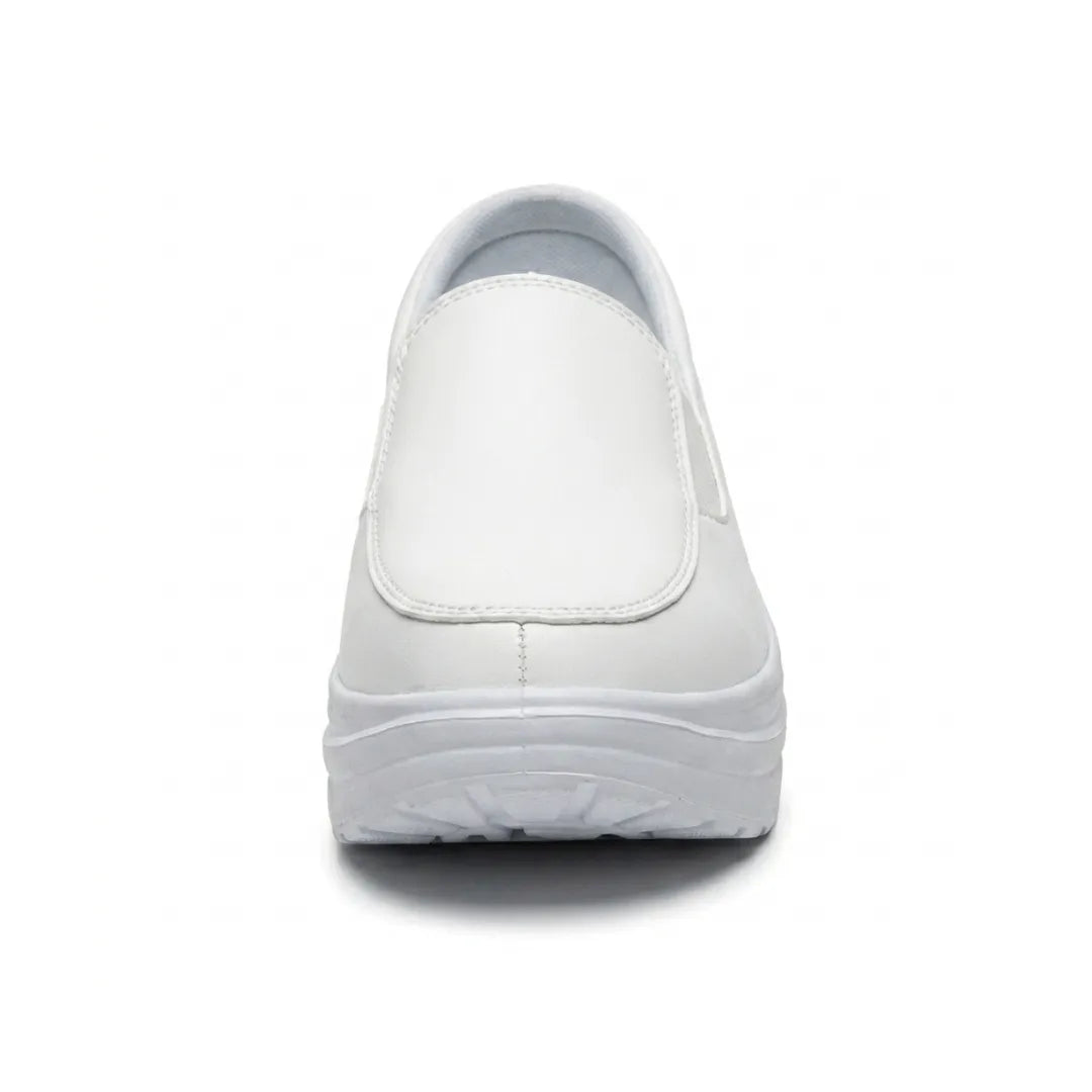 White slip-on shoe seen straight from the front, showing the stitched toe panel and chunky sole 17