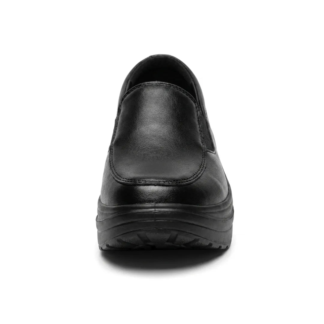 Black slip-on shoe seen straight from the front, showing the stitched toe panel and chunky sole 8