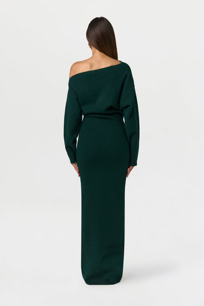 Back view of the dark green knit maxi dress, showing the asymmetric neckline and long sleeves. 14