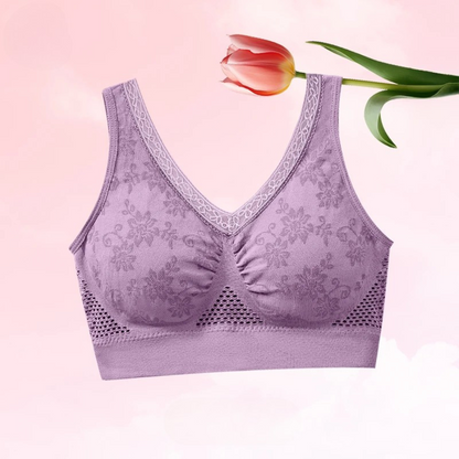 Lilac bra against a pink background with a red tulip resting across the top 6