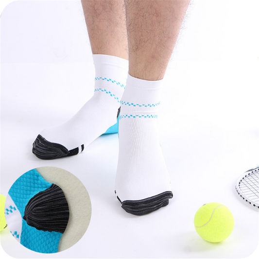 Man standing in white ankle socks with blue dotted stripes beside tennis balls, with an inset close-up of the blue heel. 2