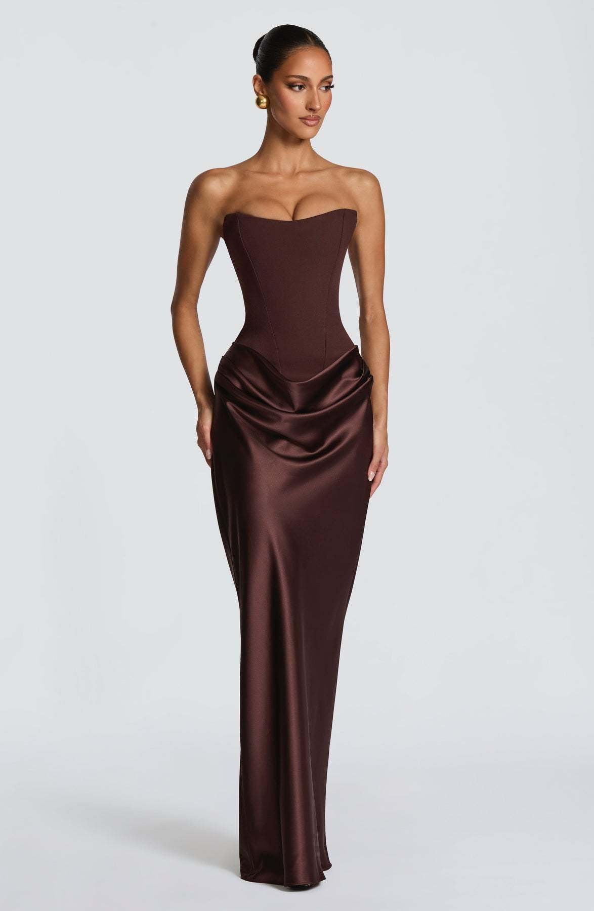 Chocolate brown corset gown without choker, model glancing sideways in front view 13