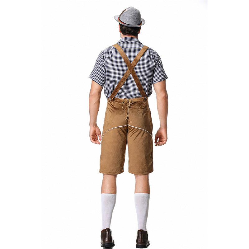 Back view of model in brown shorts with crossed straps and lace detail, checked shirt, grey hat and white socks. 10