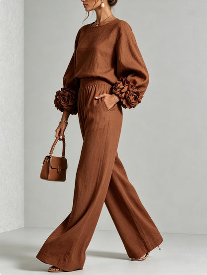Model in profile wearing the rust brown version, one hand in the trouser pocket, carrying a matching bag 5
