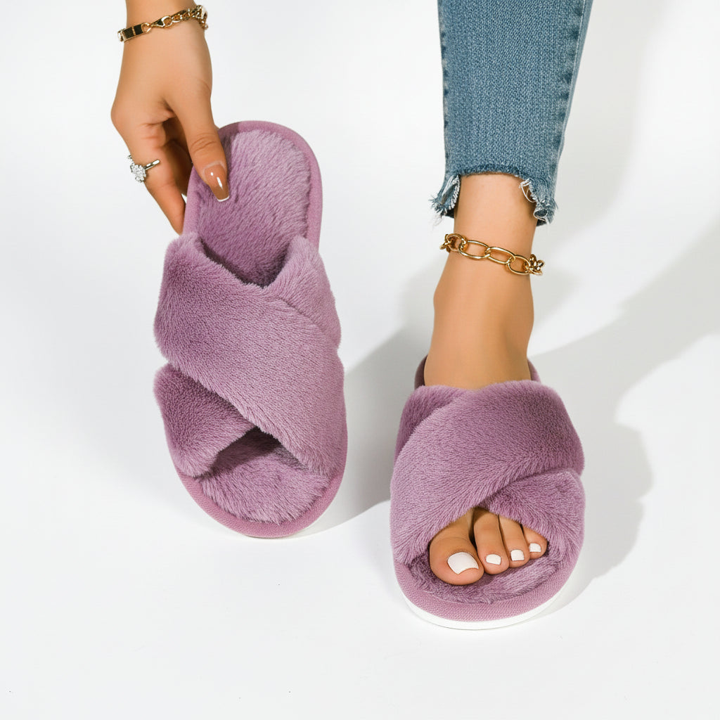 Mauve plush crossover slippers, one worn with blue jeans and one held up showing the soft lining 8