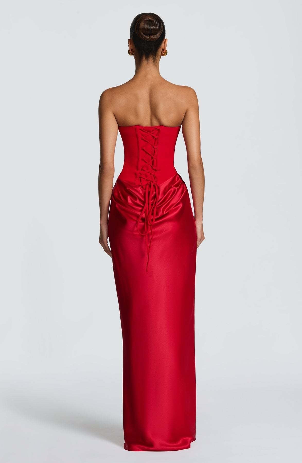 Back view of the red dress showing the corset lacing and ties over the gathered satin skirt 28