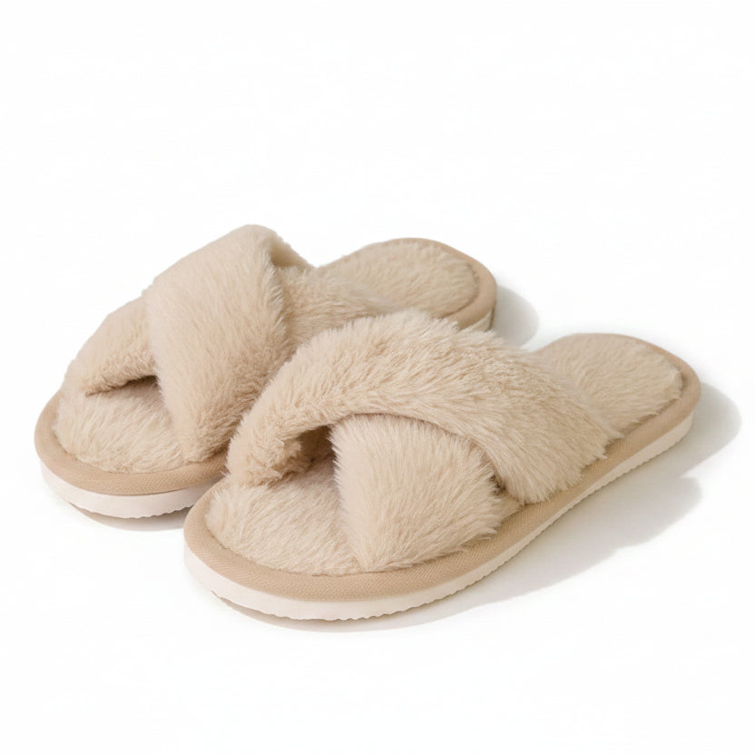Pair of beige fluffy crossover-strap slippers with white soles, shown on a plain white background 1