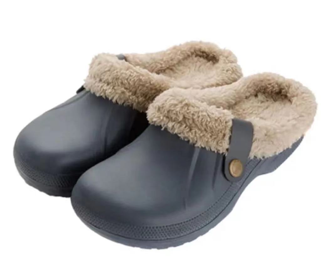 Pair of grey-blue clogs with beige fleece lining on a plain white background 15