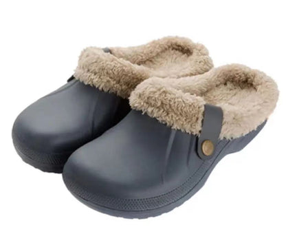 Pair of grey-blue clogs with beige fleece lining on a plain white background 15