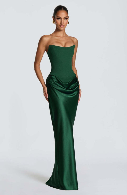 Emerald green strapless corset gown with draped hip satin skirt, shown at a three-quarter front angle 2