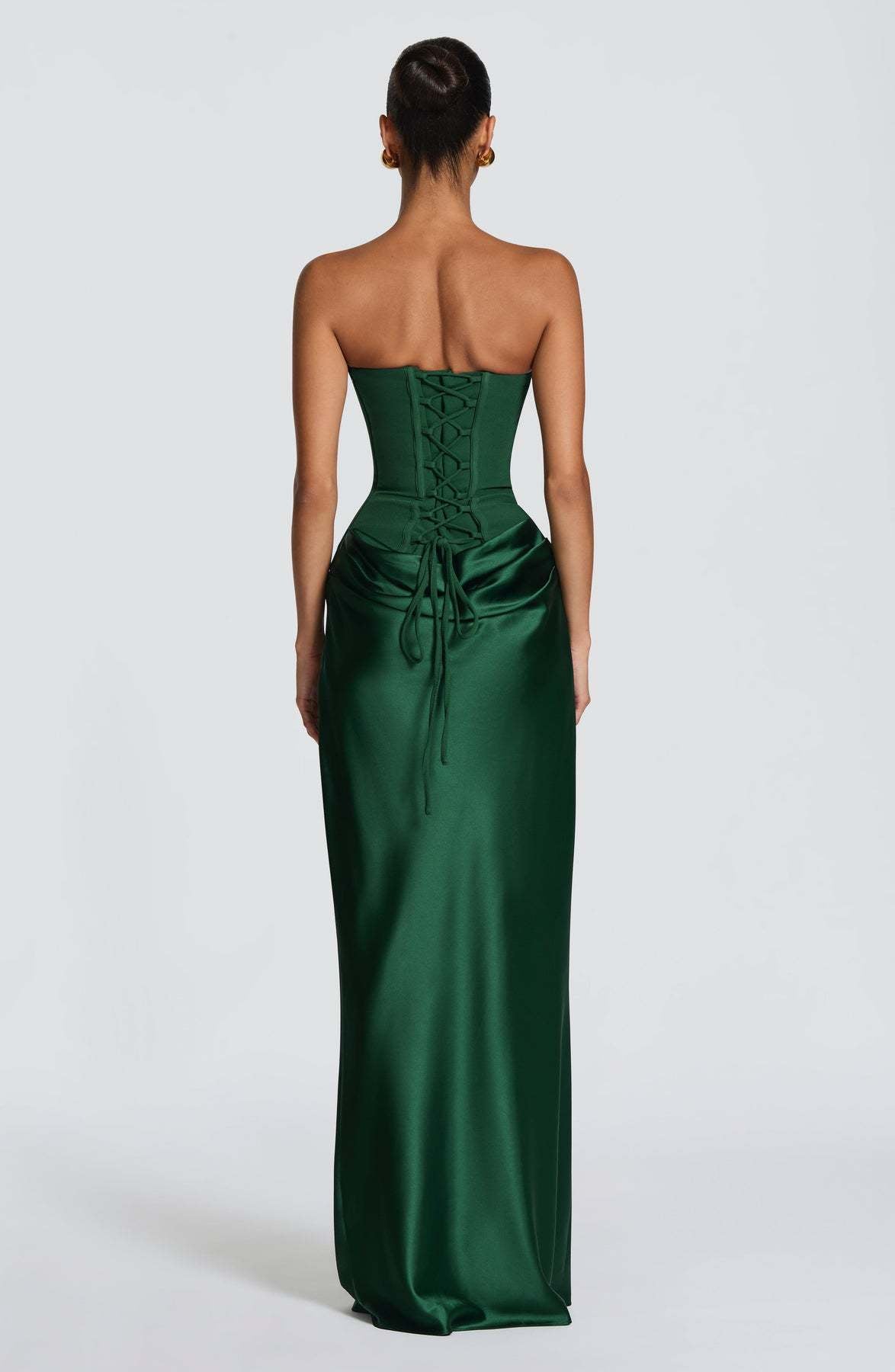 Back of emerald green corset gown showing lace-up corset back and ties over satin skirt 3