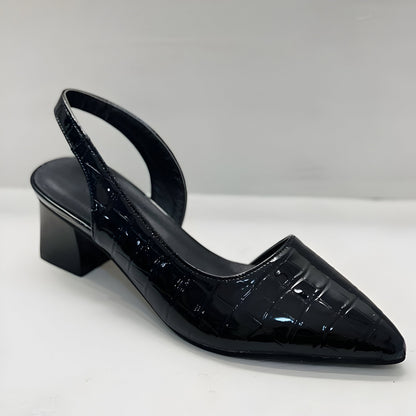 Single black patent crocodile-effect slingback heel with pointed toe and low block heel, seen from the front on white. 4