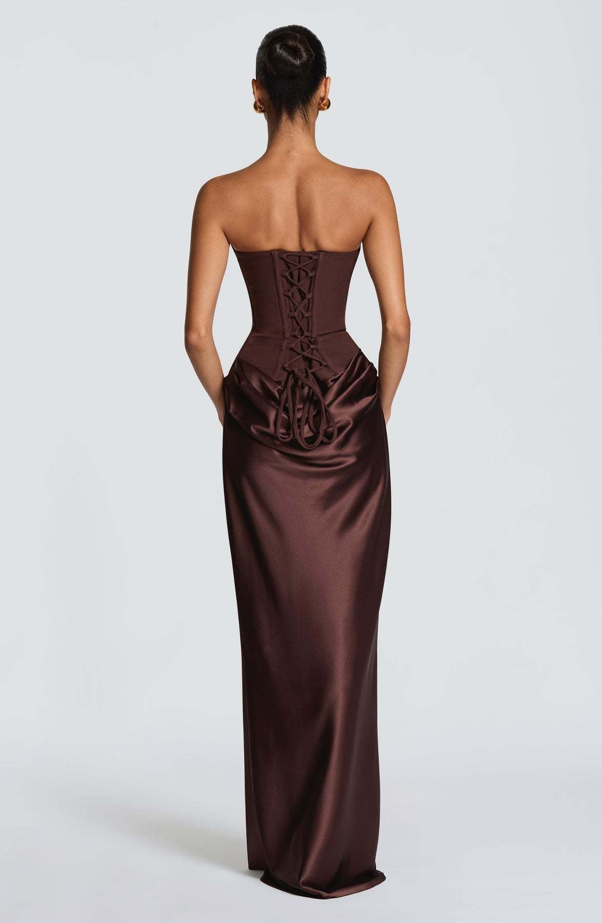 Back of chocolate brown corset gown with lace-up back and looped ties over draped satin 11