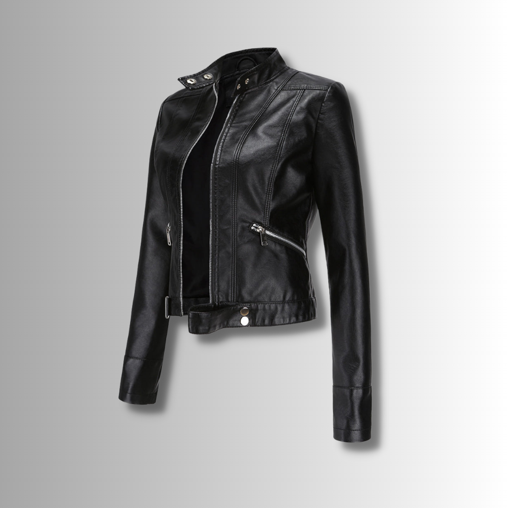 Black cropped jacket shown at an angle on a grey gradient background, with stand collar, open zip and belted hem. 1