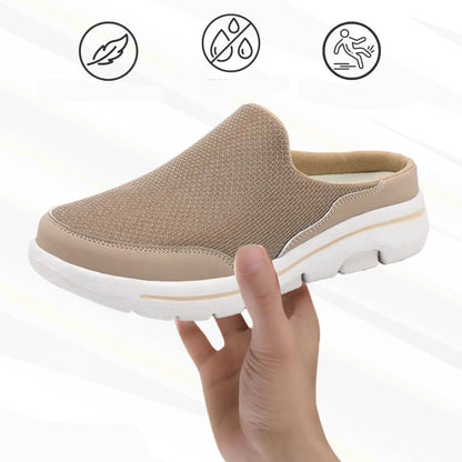 Beige mesh slip-on mule with white sole held up in a hand, with three small feature icons above. 10