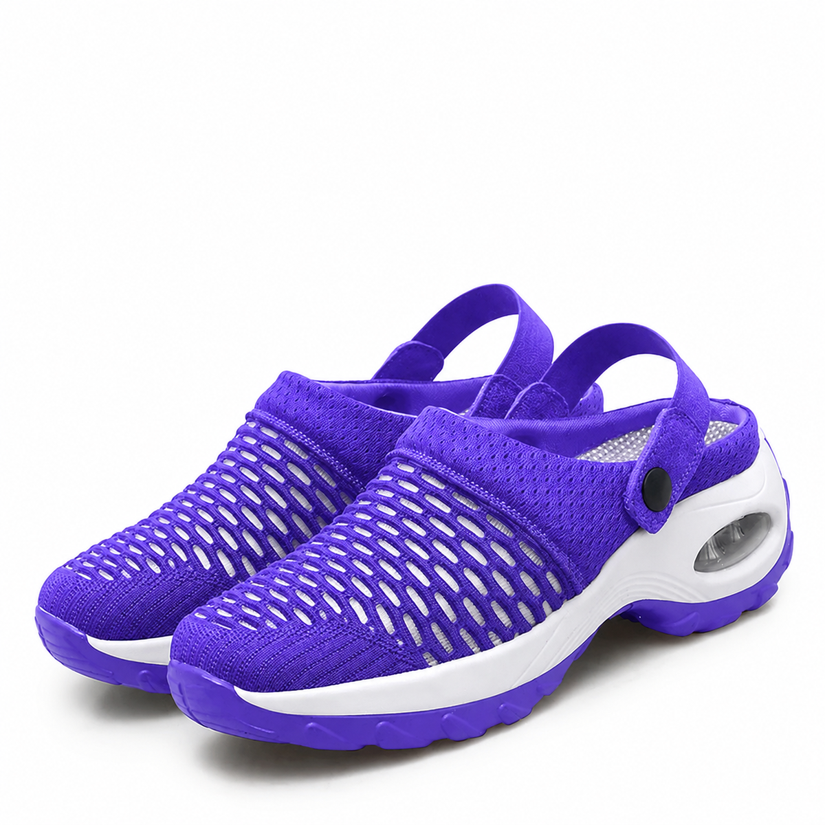 Pair of purple clogs with open oval mesh cut-outs, a white air-cushion midsole, heel straps and snap buttons. 3