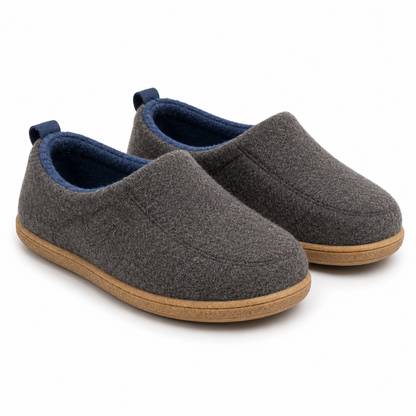 Pair of charcoal grey slippers from the front, with blue lining, blue heel loops and a tan hard sole. 9