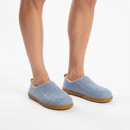 Man's bare legs wearing the light blue slippers with tan soles, shown on a plain white background. 4