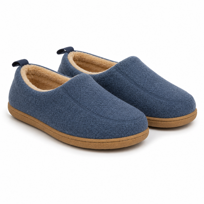 Pair of navy blue slippers from the front, with cream fleece lining, navy heel loops and a tan hard sole. 5