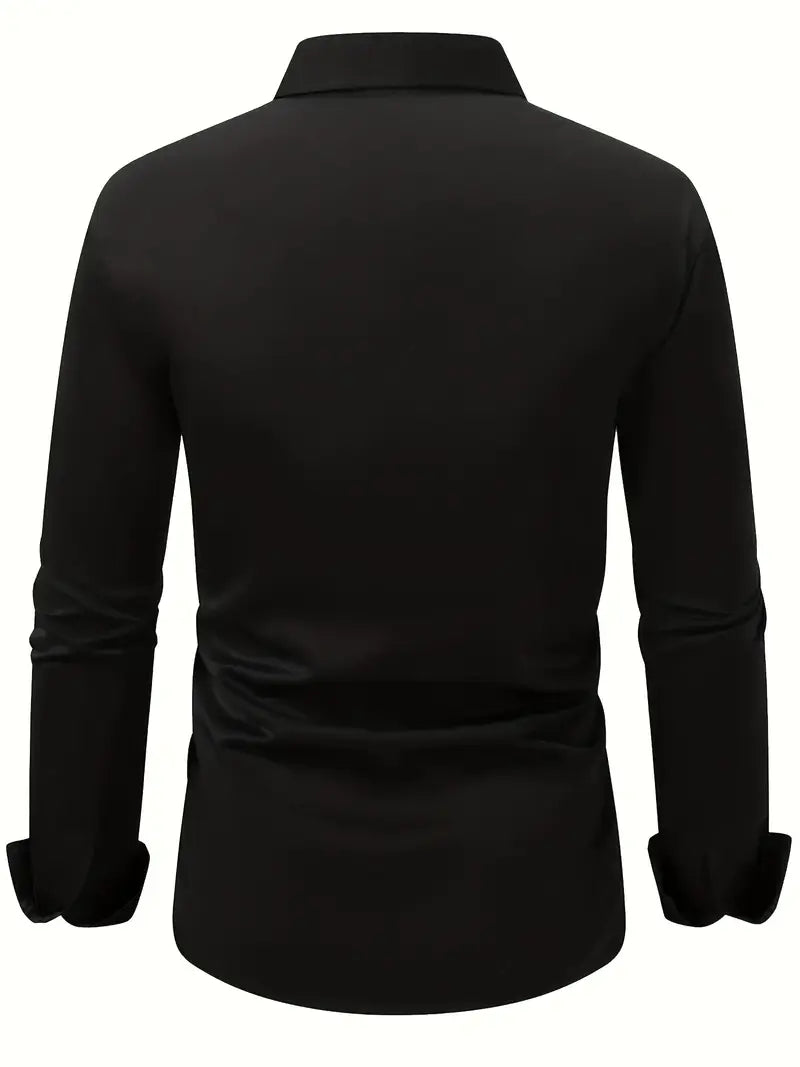 Back view of the black shirt laid out flat, showing the plain back, collar and long sleeves with cuffs. 10