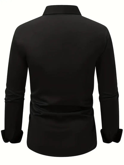 Back view of the black shirt laid out flat, showing the plain back, collar and long sleeves with cuffs. 10