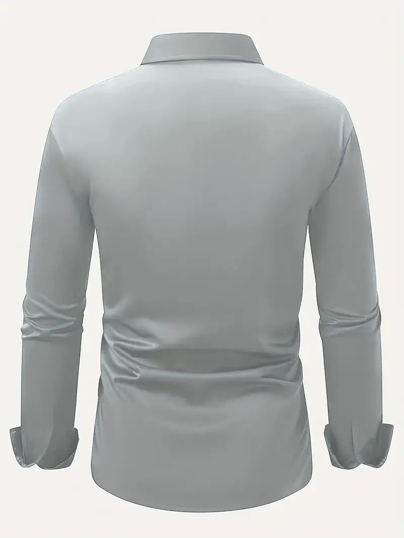 Back view of the pale grey shirt laid out flat, showing the plain back, collar and long sleeves with cuffs. 14