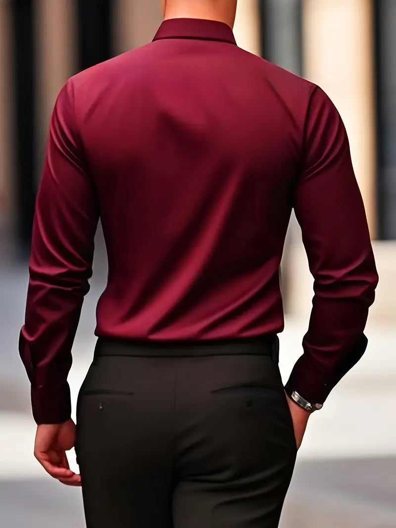 Back view of a model wearing the burgundy shirt with black trousers, showing the smooth back and sleeves. 16