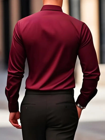 Back view of a model wearing the burgundy shirt with black trousers, showing the smooth back and sleeves. 16