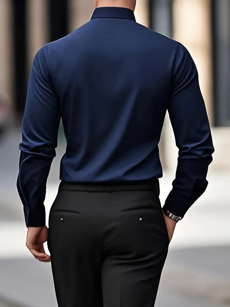 Back view of a model wearing the navy blue shirt with black trousers, showing the smooth back and cuffs. 17