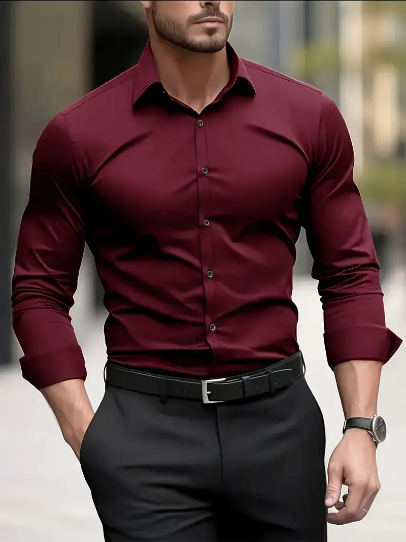 Front view of the burgundy long-sleeved shirt worn by a model with black trousers, belt and wristwatch. 3