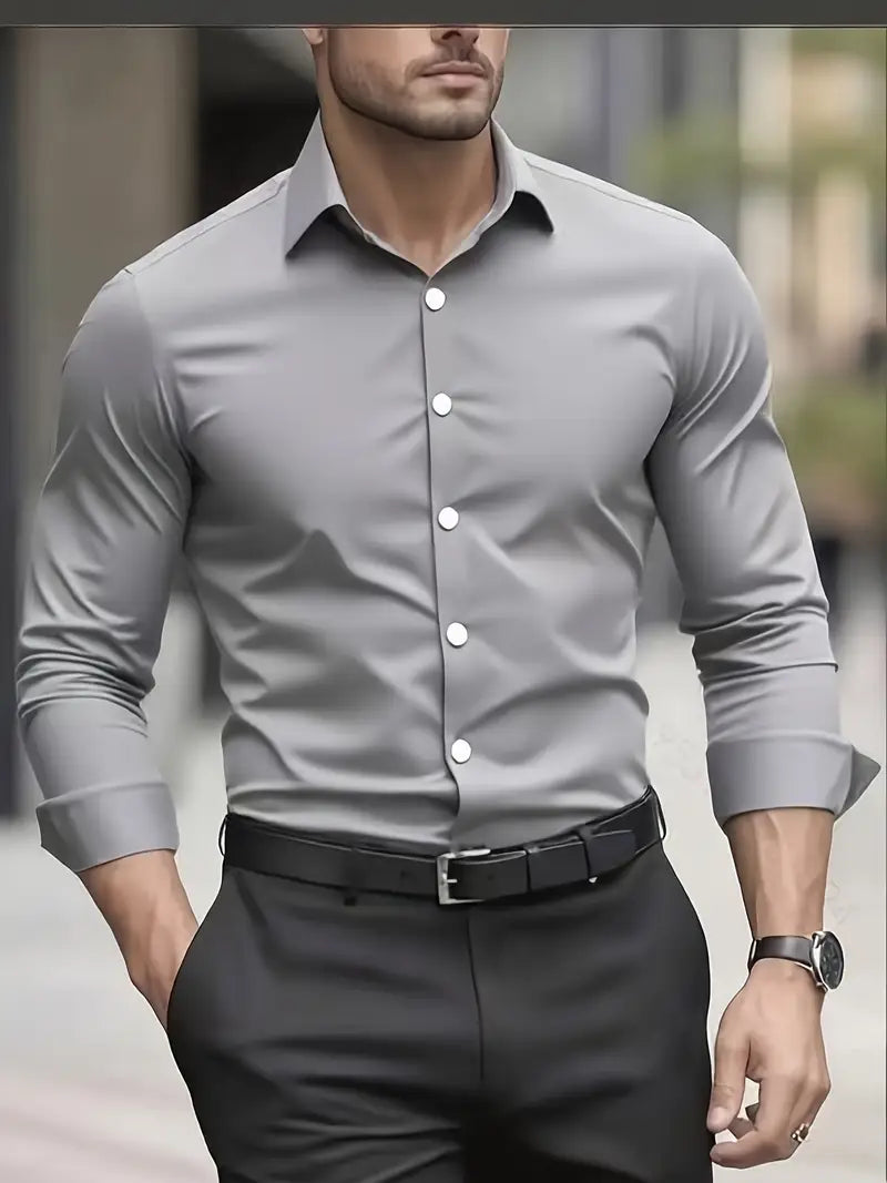 Front view of the grey long-sleeved shirt with white buttons, worn by a model with black trousers and belt. 5