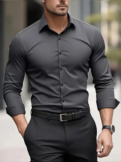 Front view of the charcoal grey long-sleeved shirt with dark buttons, worn by a model with black trousers and belt. 6