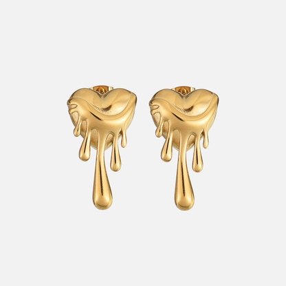 Pair of gold-tone dripping heart earrings seen from the front on a plain pale background 1
