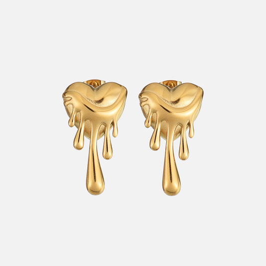 Pair of gold-tone dripping heart earrings seen from the front on a plain pale background 1