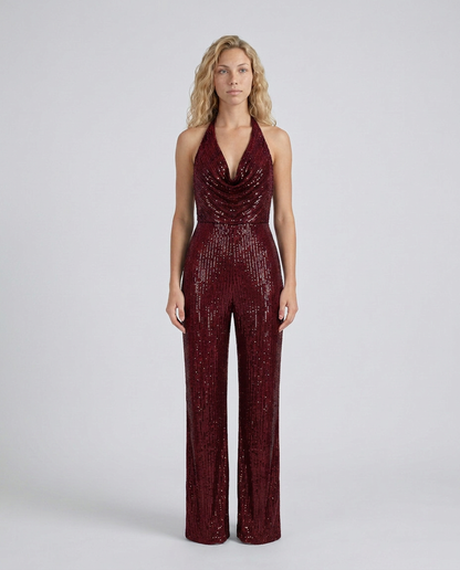 Deep burgundy sequin halter jumpsuit with draped cowl neckline, model standing straight, front view 25