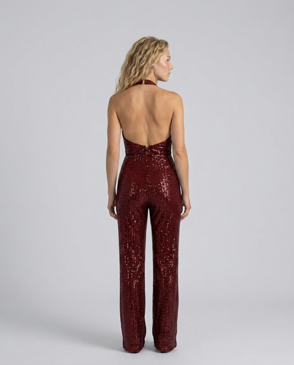 Back view of burgundy sequin jumpsuit showing the open back, halter fastening and centre zip 26