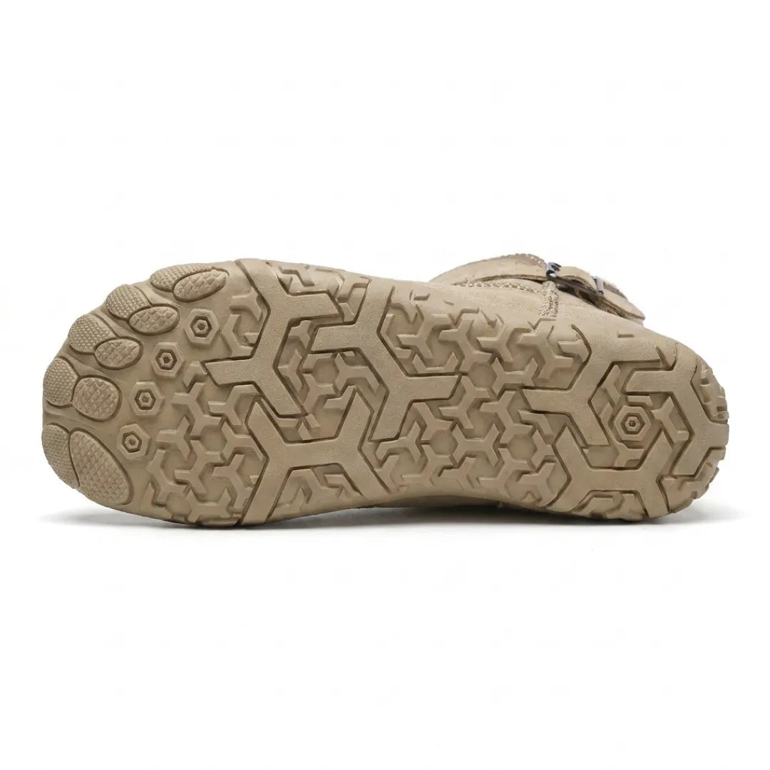 Underside of a beige boot showing the hexagonal tread pattern and separated toe pads 9