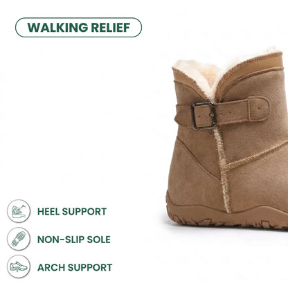 Tan suede boot cropped at the ankle, showing buckle strap, fleece lining and treaded sole 22