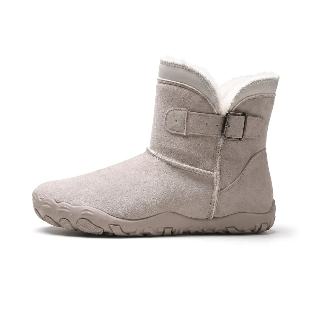 Side view of a light grey suede ankle boot with buckle strap and fleece collar 28