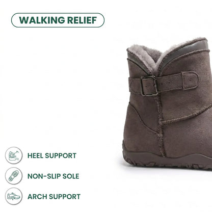 Taupe suede boot cropped at the ankle, showing buckle strap, grey fleece lining and treaded sole 40