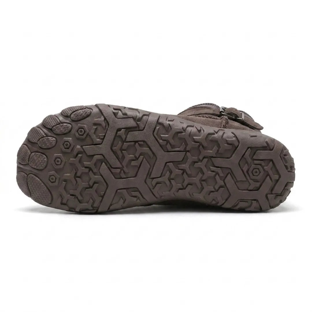 Underside of the boot showing the hexagonal tread pattern and separated toe pads of the sole 45