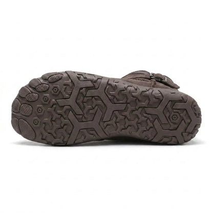 Underside of the boot showing the hexagonal tread pattern and separated toe pads of the sole 45