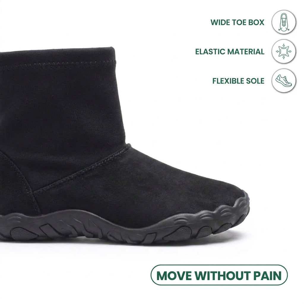 Close-up of the black boot's wide rounded toe and flexible sole, with feature icons 14