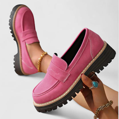 Pink suede-look loafers, one held up to show the thick lugged sole and stitching 3