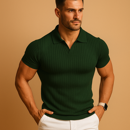 Model wearing the ribbed-knit polo in dark green with a V-neck collar, paired with white trousers and a light smartwatch. 3