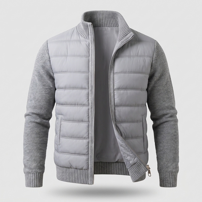 Light grey jacket laid flat from the front, unzipped, showing quilted body and ribbed knit collar and cuffs 3