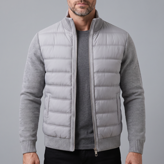 Bearded man wearing the light grey jacket unzipped over a dark grey t-shirt, front view 1