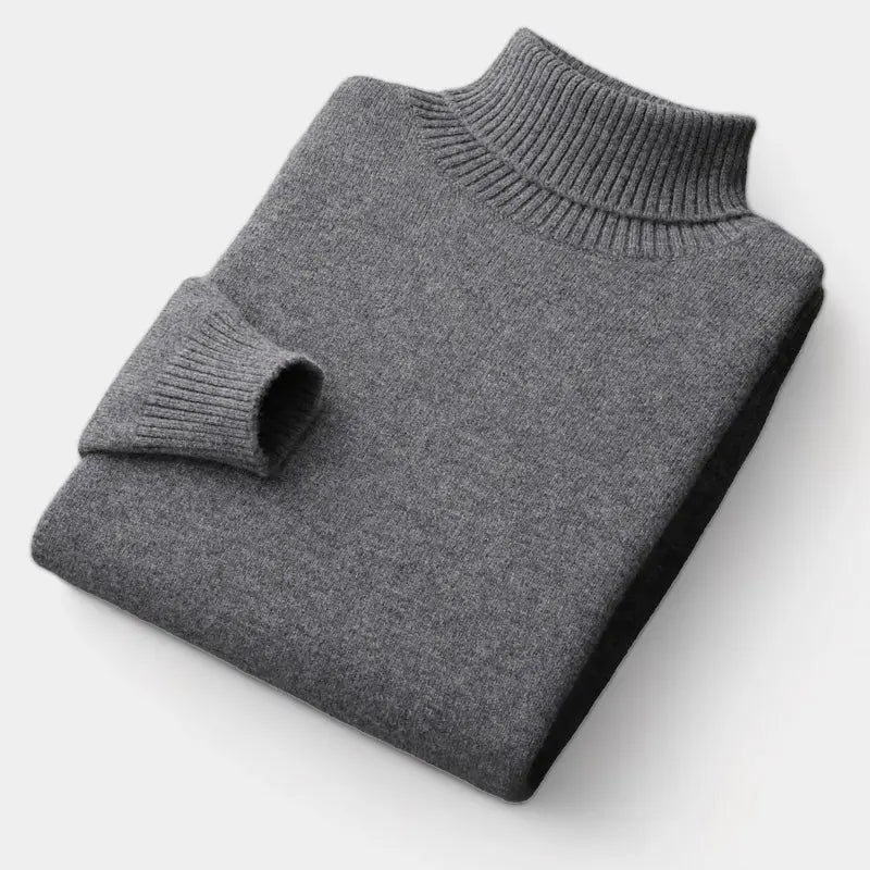 Folded roll-neck jumper in charcoal grey, with the ribbed collar and one cuff showing 3