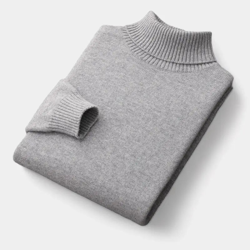 Folded roll-neck jumper in light grey, with the ribbed collar and one cuff showing 6